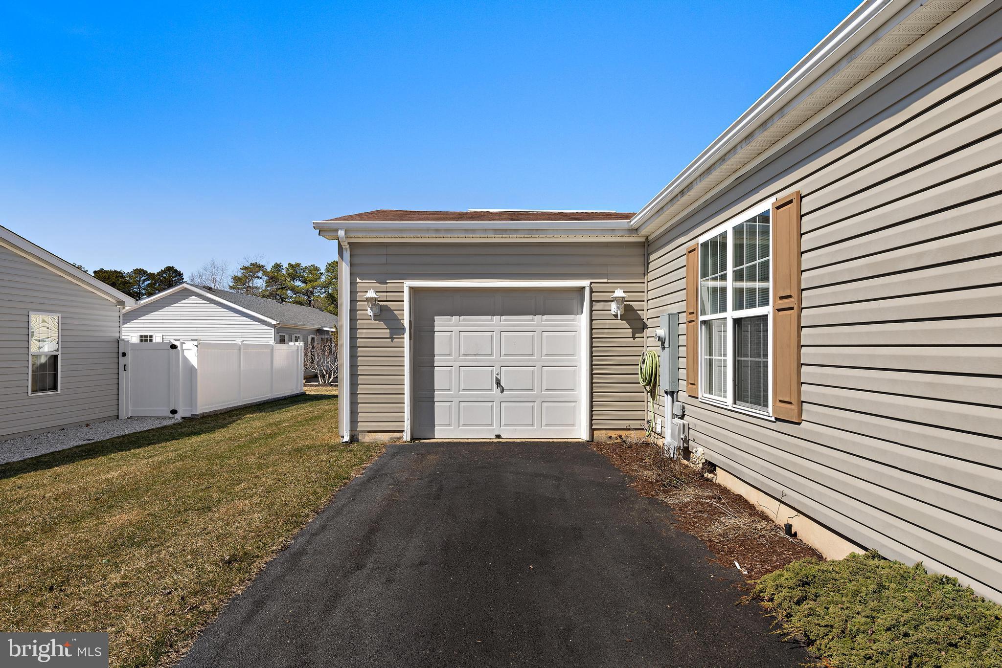 75 Oak Ridge Lane Manahawkin, NJ 08050 - Photo 33 of 50 a front view of a house with a yard