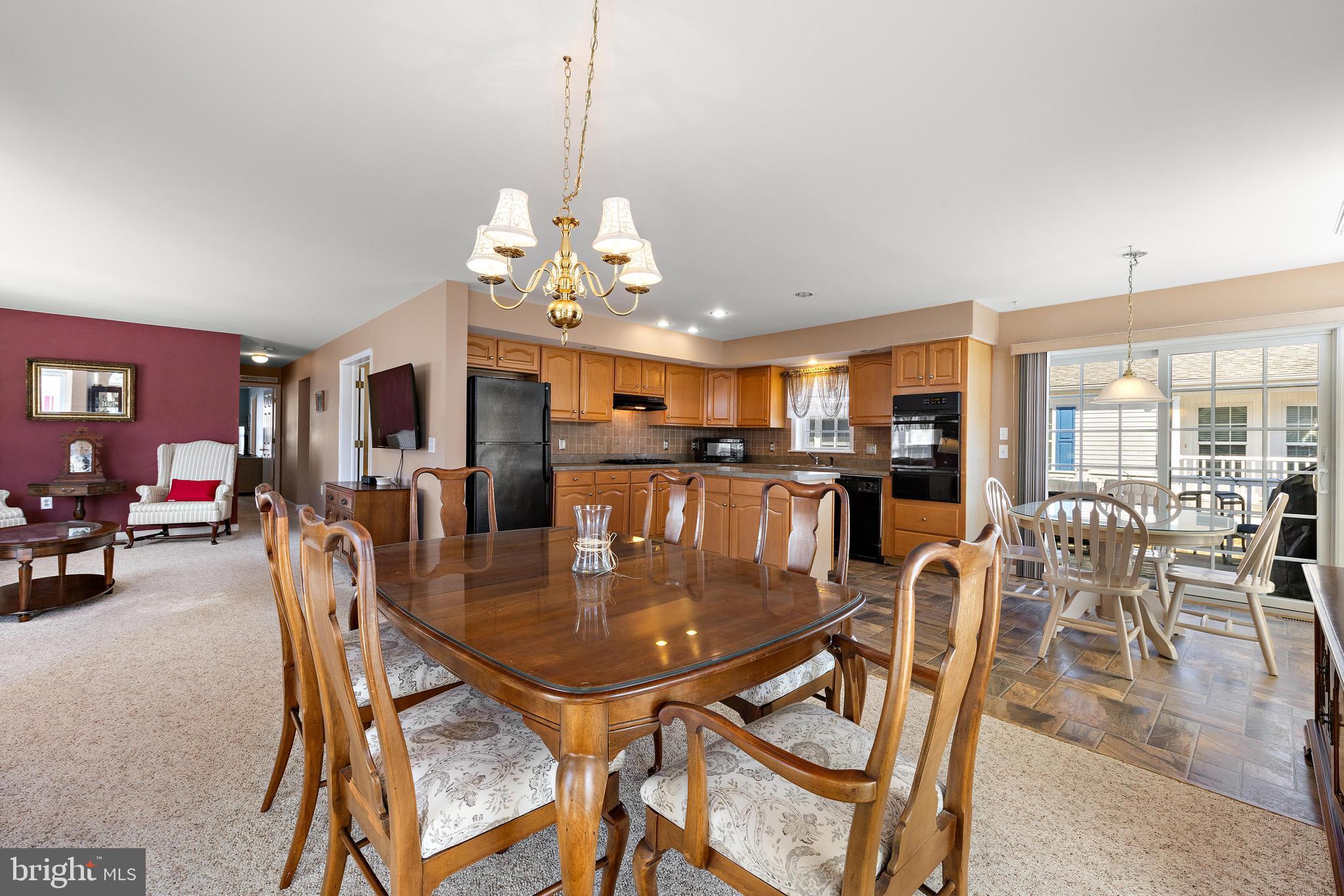 75 Oak Ridge Lane Manahawkin, NJ 08050 - Photo 7 of 50 a view of a dining room with furniture window and wooden floor