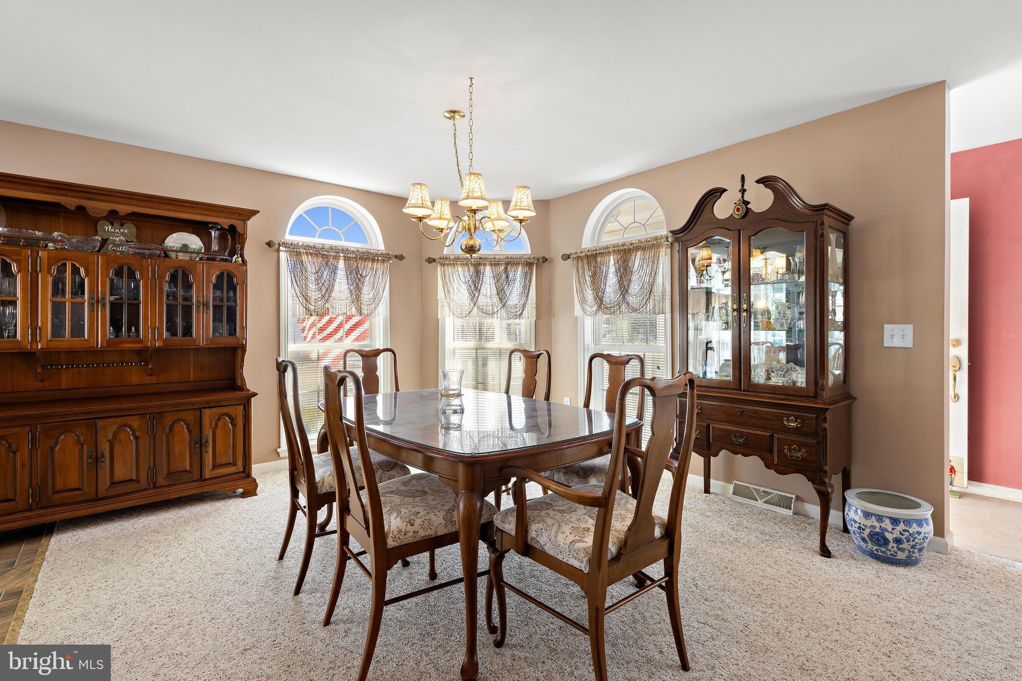 75 Oak Ridge Lane Manahawkin, NJ 08050 - Photo 8 of 50 a view of a dining room with furniture and a chandelier