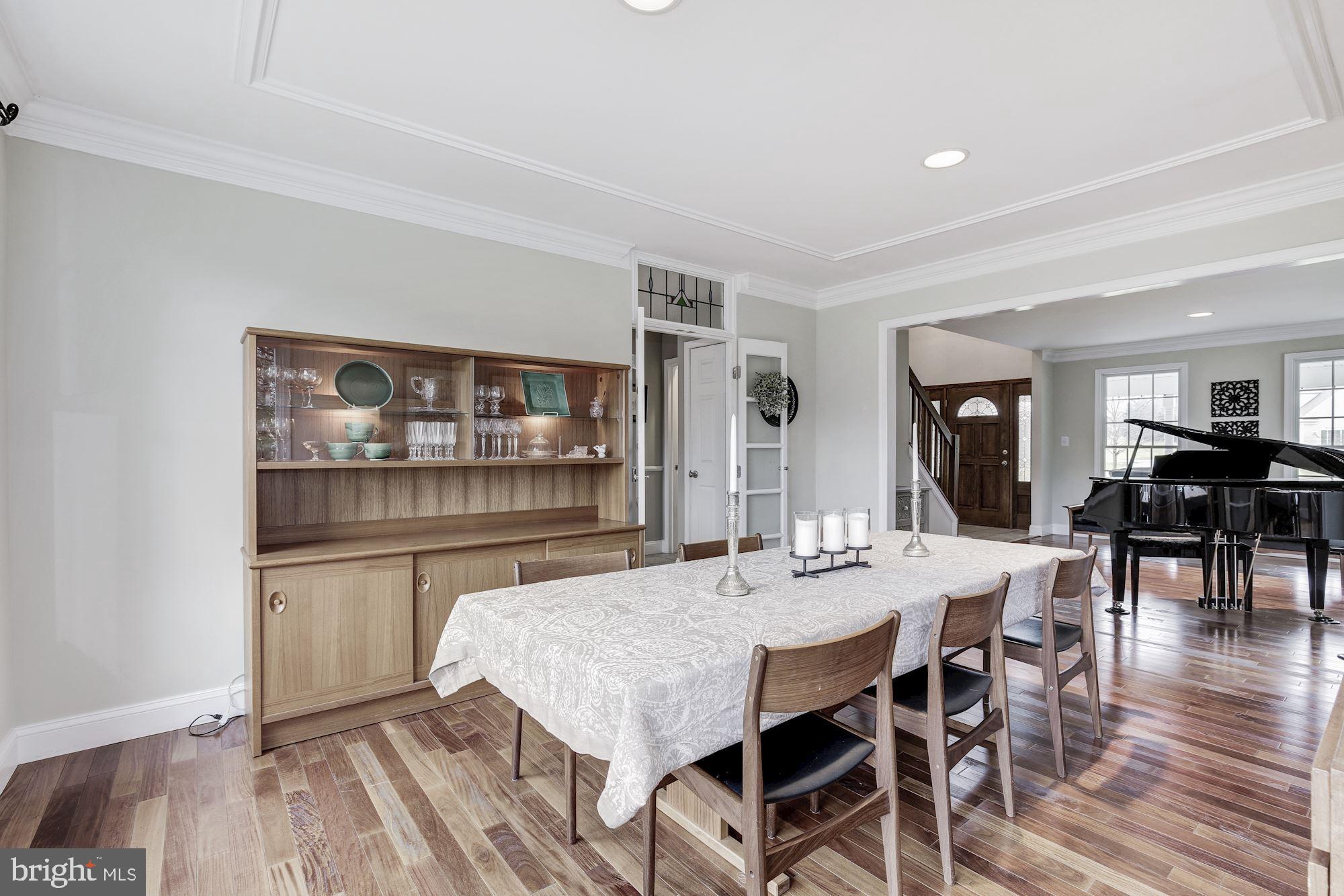 5508 Adams Ridge Road Clarksville, MD 21029 - Photo 13 of 54 Formal dining room with crown molding.