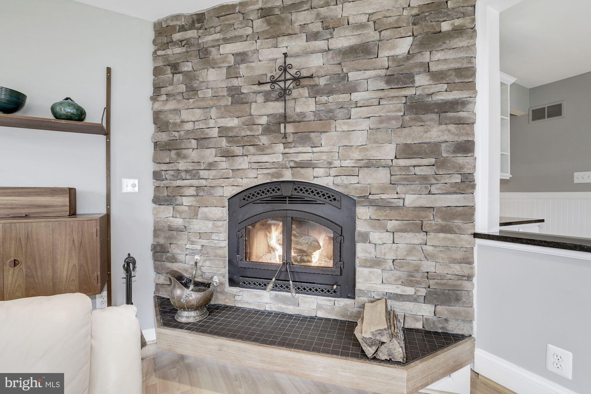 5508 Adams Ridge Road Clarksville, MD 21029 - Photo 20 of 54 Wood-burning fireplace with stacked stone surround