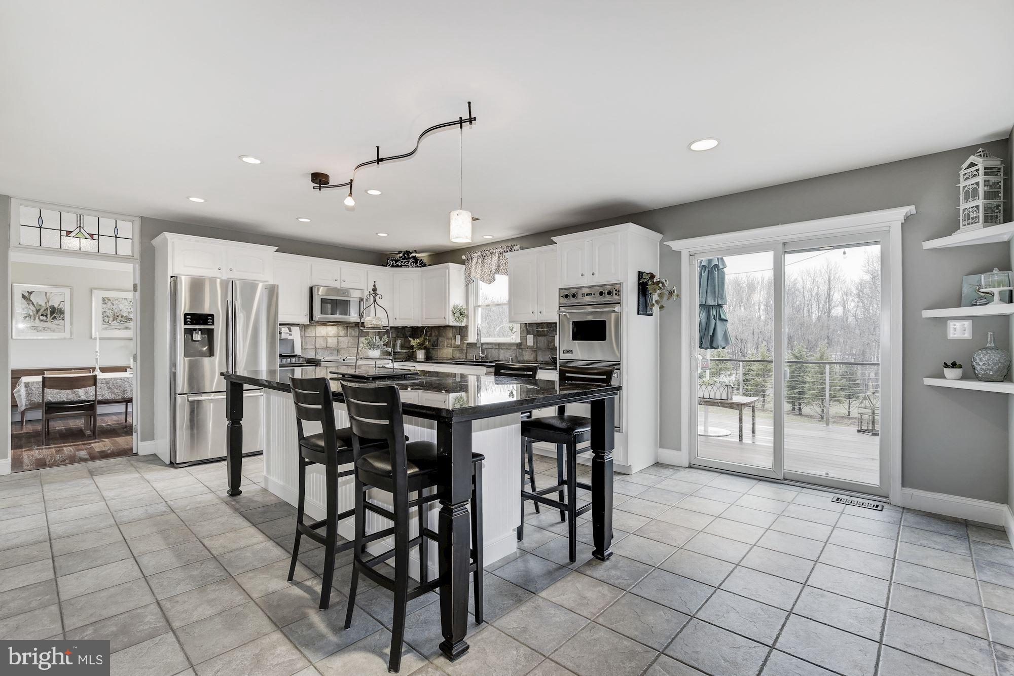 5508 Adams Ridge Road Clarksville, MD 21029 - Photo 4 of 54 Bright, open kitchen w/ sliding door to deck/patio