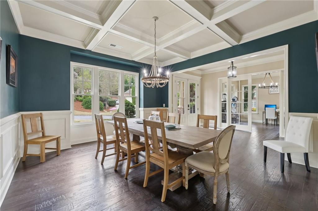1710 Bramble Bush Way Suwanee, GA 30024 - Photo 15 of 40 a view of a dining room with furniture window and wooden floor