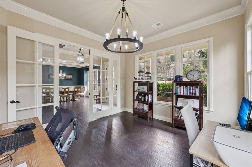 1710 Bramble Bush Way Suwanee, GA 30024 - Photo 17 of 40 a view of a livingroom with furniture wooden floor chandelier