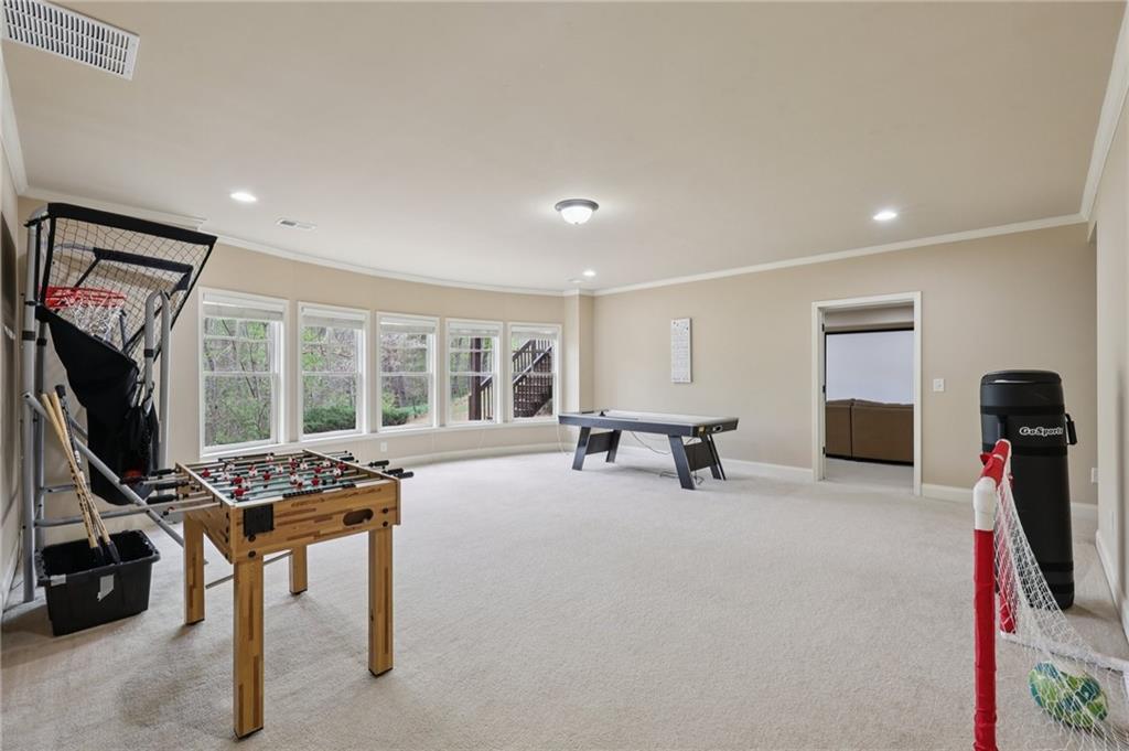 1710 Bramble Bush Way Suwanee, GA 30024 - Photo 30 of 40 a view of a livingroom with workspace and a window