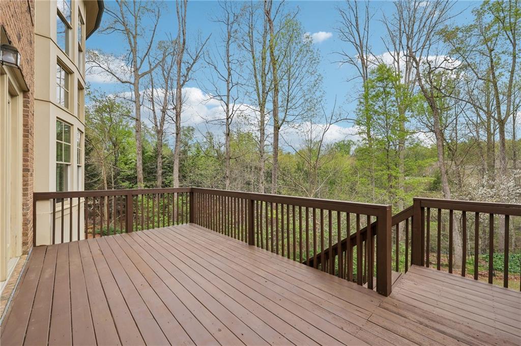 1710 Bramble Bush Way Suwanee, GA 30024 - Photo 32 of 40 a balcony with wooden floor and fence