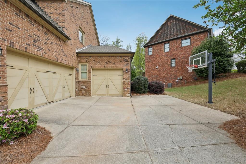 1710 Bramble Bush Way Suwanee, GA 30024 - Photo 33 of 40 a view of a garage of the house