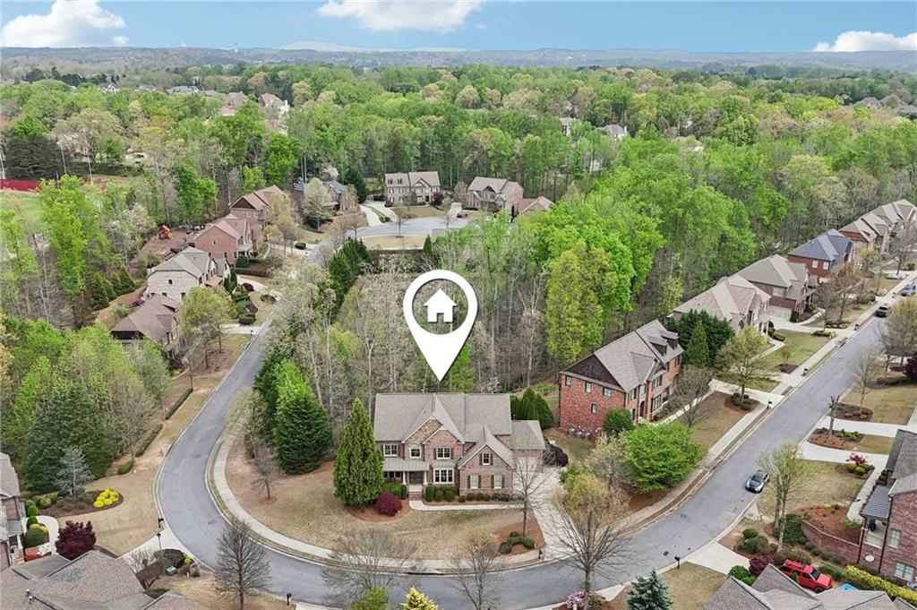 1710 Bramble Bush Way Suwanee, GA 30024 - Photo 37 of 40 an aerial view of a house with yard swimming pool and outdoor seating