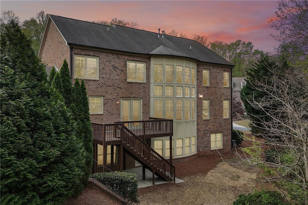 1710 Bramble Bush Way Suwanee, GA 30024 - Photo 39 of 40 a front view of a house with staircase