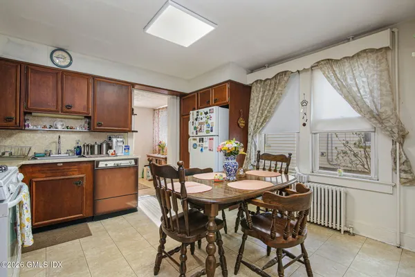 a view of a dining room with furniture and window