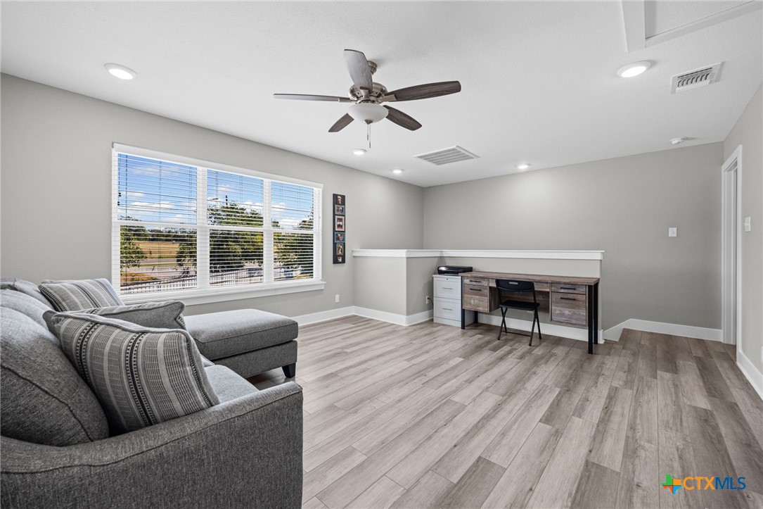 28099 Fm 2670 Killeen, TX 76549 - Photo 20 of 48 a living room with furniture and a wooden floor