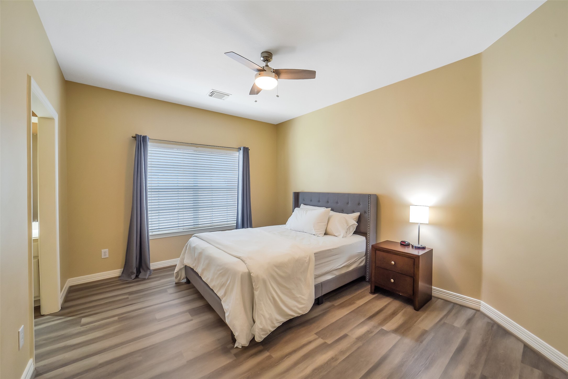 24403 Falcon Point Drive Katy, TX 77494 - Photo 27 of 32 A bright, well-sized secondary bedroom with ample natural light, perfectly positioned near the shared bathroom.