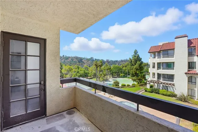 a view of a balcony with city view