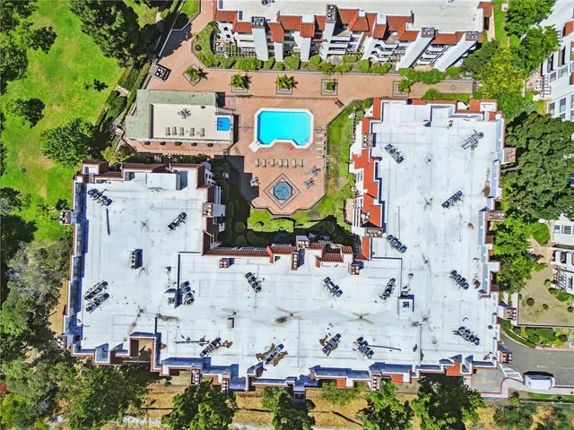 an aerial view of residential house with outdoor space and parking
