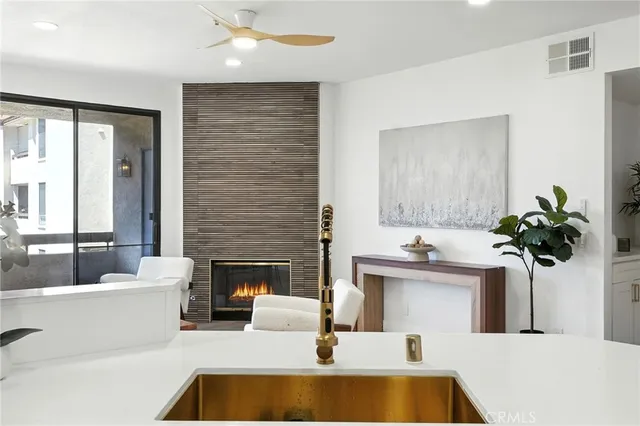 a living room with furniture and fireplace