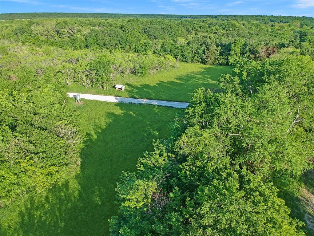 7304 Shady Lane Scurry, TX 75158 - Photo 18 of 40 Aerial view of property's location featuring a heavily wooded area