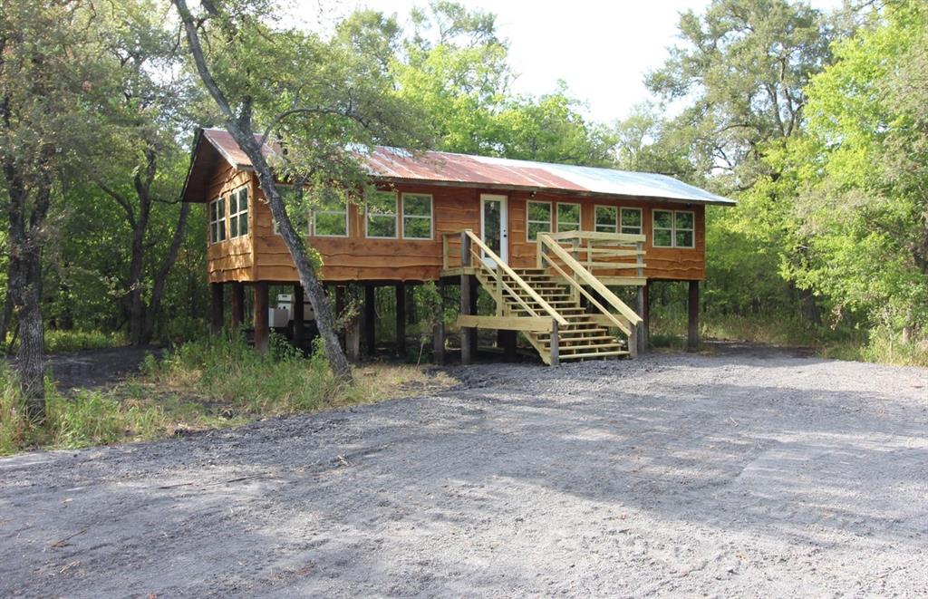 7304 Shady Lane Scurry, TX 75158 - Photo 34 of 40 View of front facade featuring stairs and a metal roof