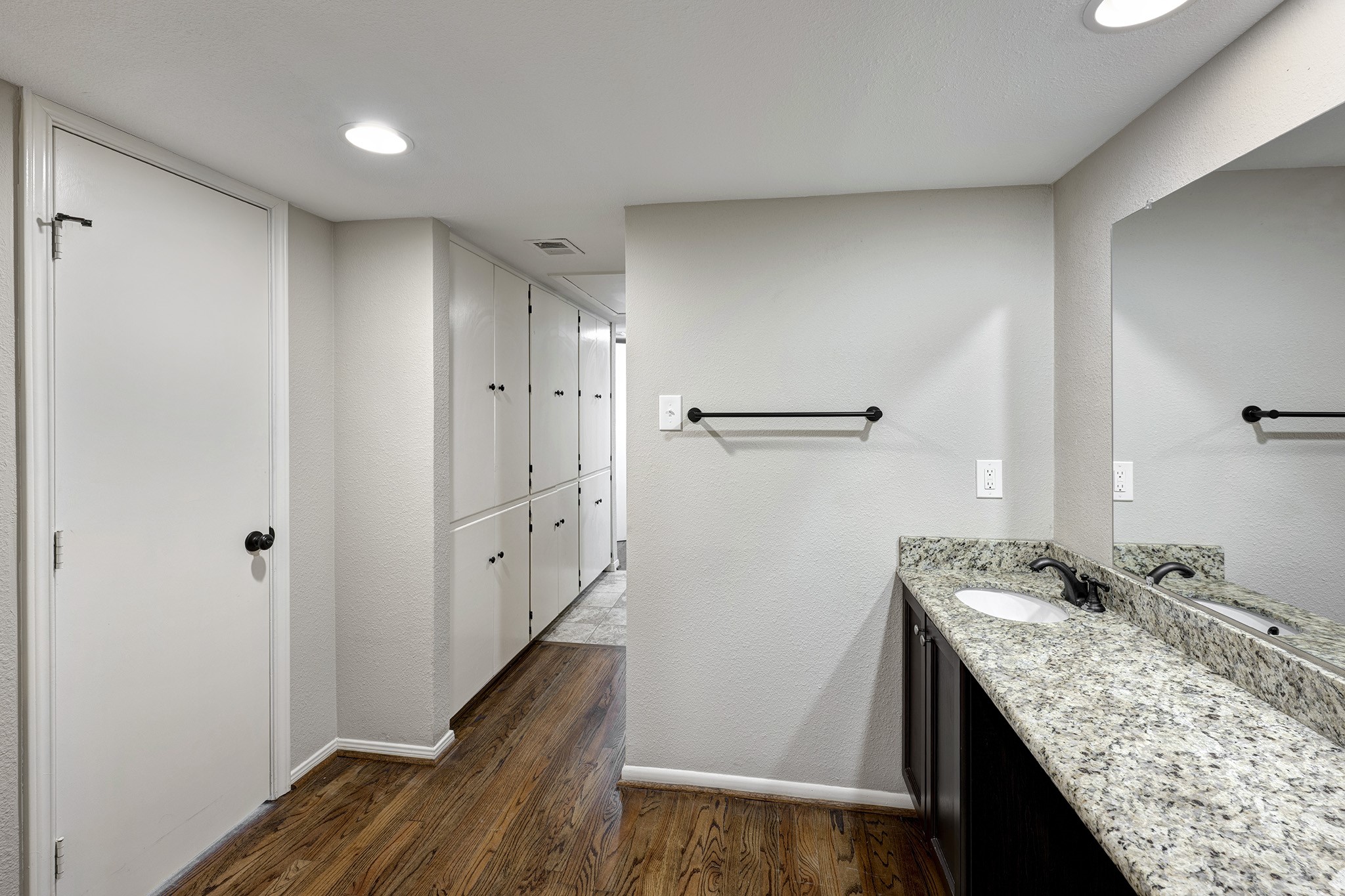 1122 Autrey Street, Unit 5 Houston, TX 77006 - Photo 16 of 32 a bathroom with a granite countertop sink a mirror and shower