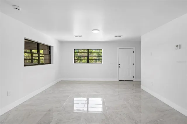 an empty room with windows