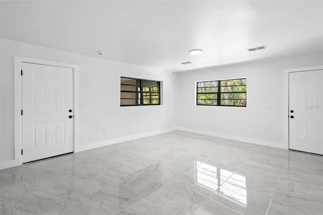 an empty room with windows