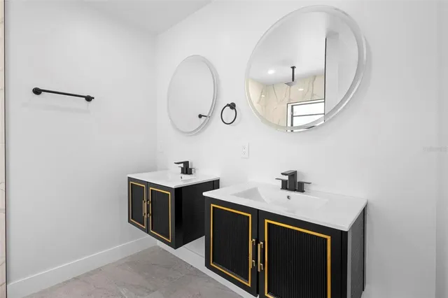 a utility room with sink dryer and washer