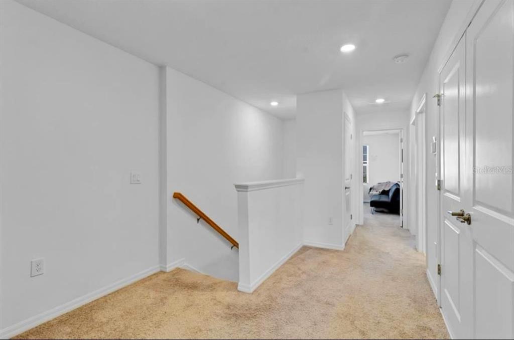 3609 Anibal Street Kissimmee, FL 34746 - Photo 11 of 17 a view of a hallway with workspace