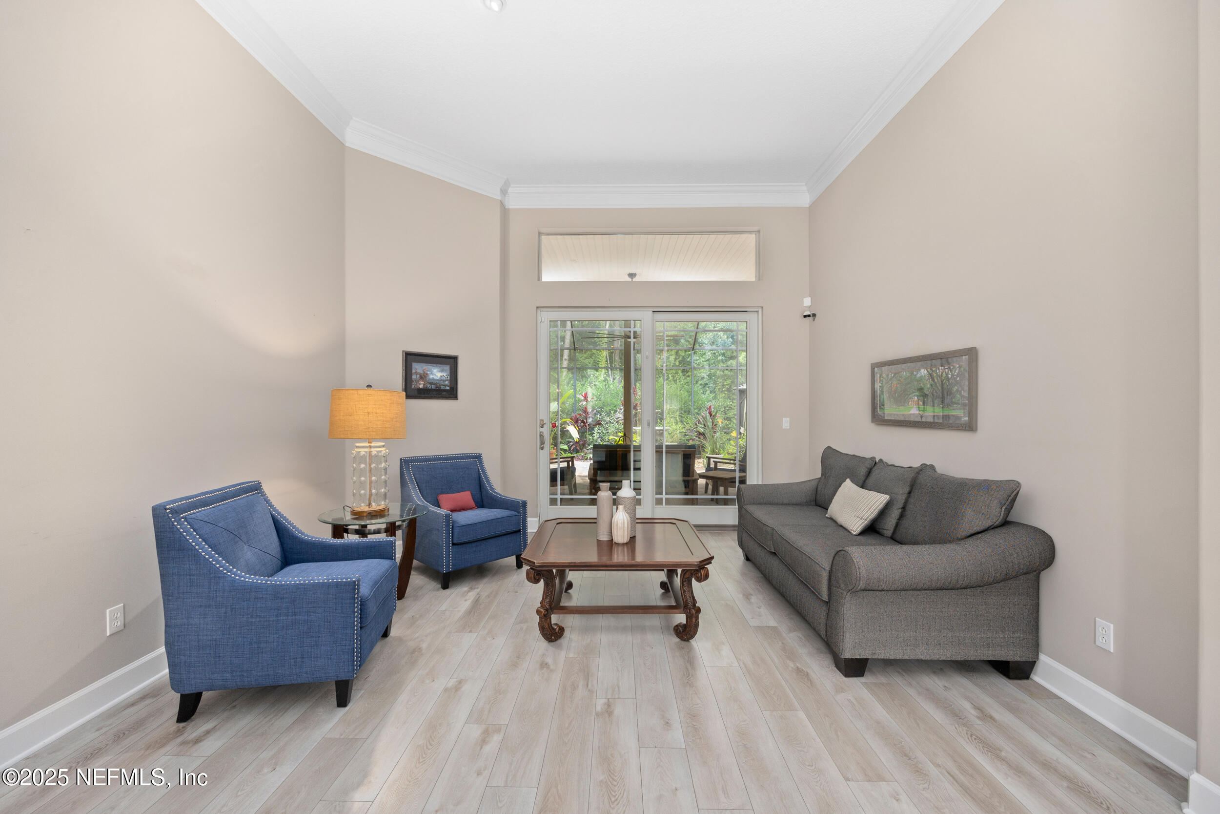 1854 West Cobblestone Lane St. Augustine, FL 32092 - Photo 18 of 72 a living room with furniture and a large window