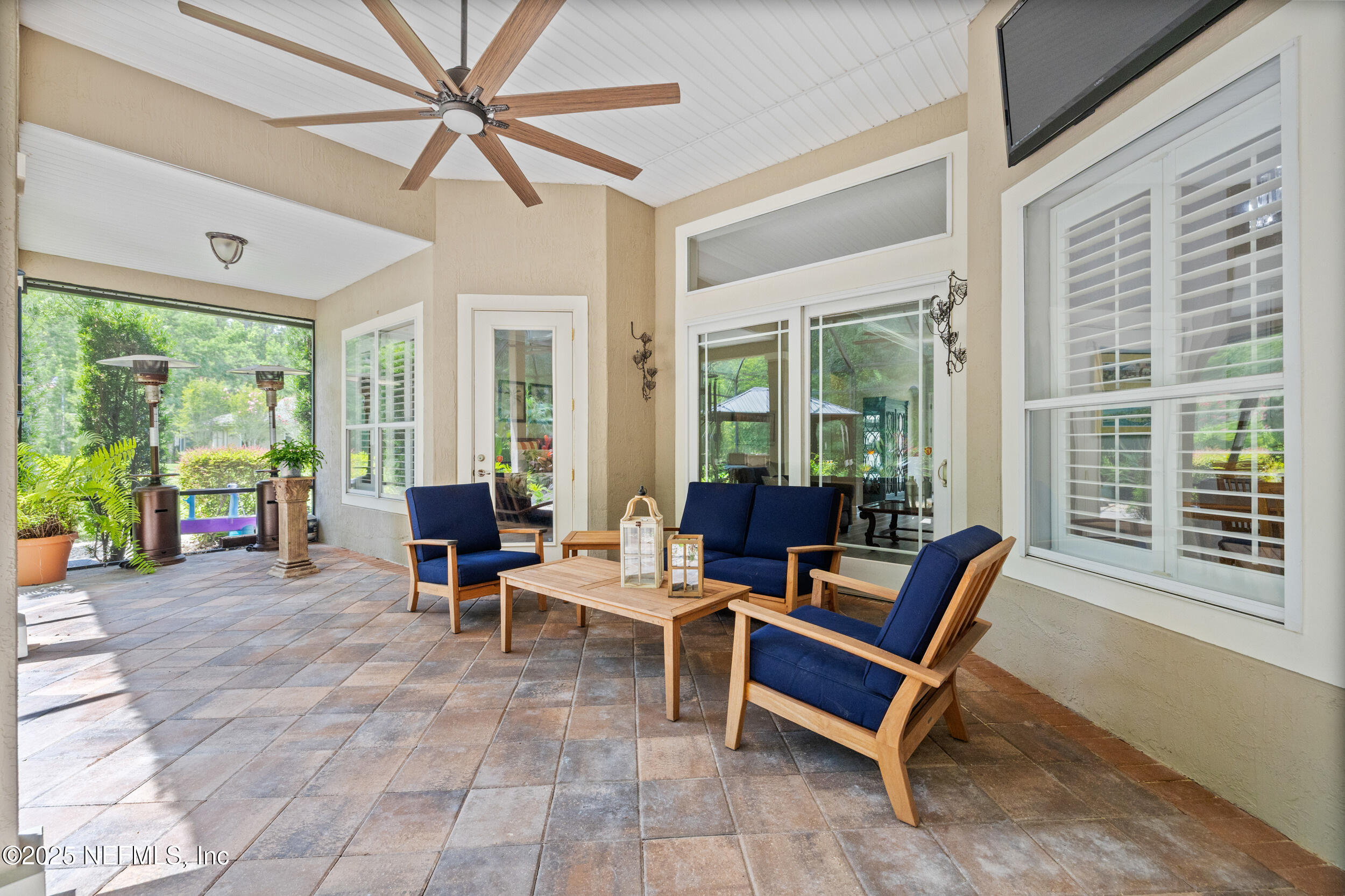 1854 West Cobblestone Lane St. Augustine, FL 32092 - Photo 28 of 72 a living room with furniture and large windows