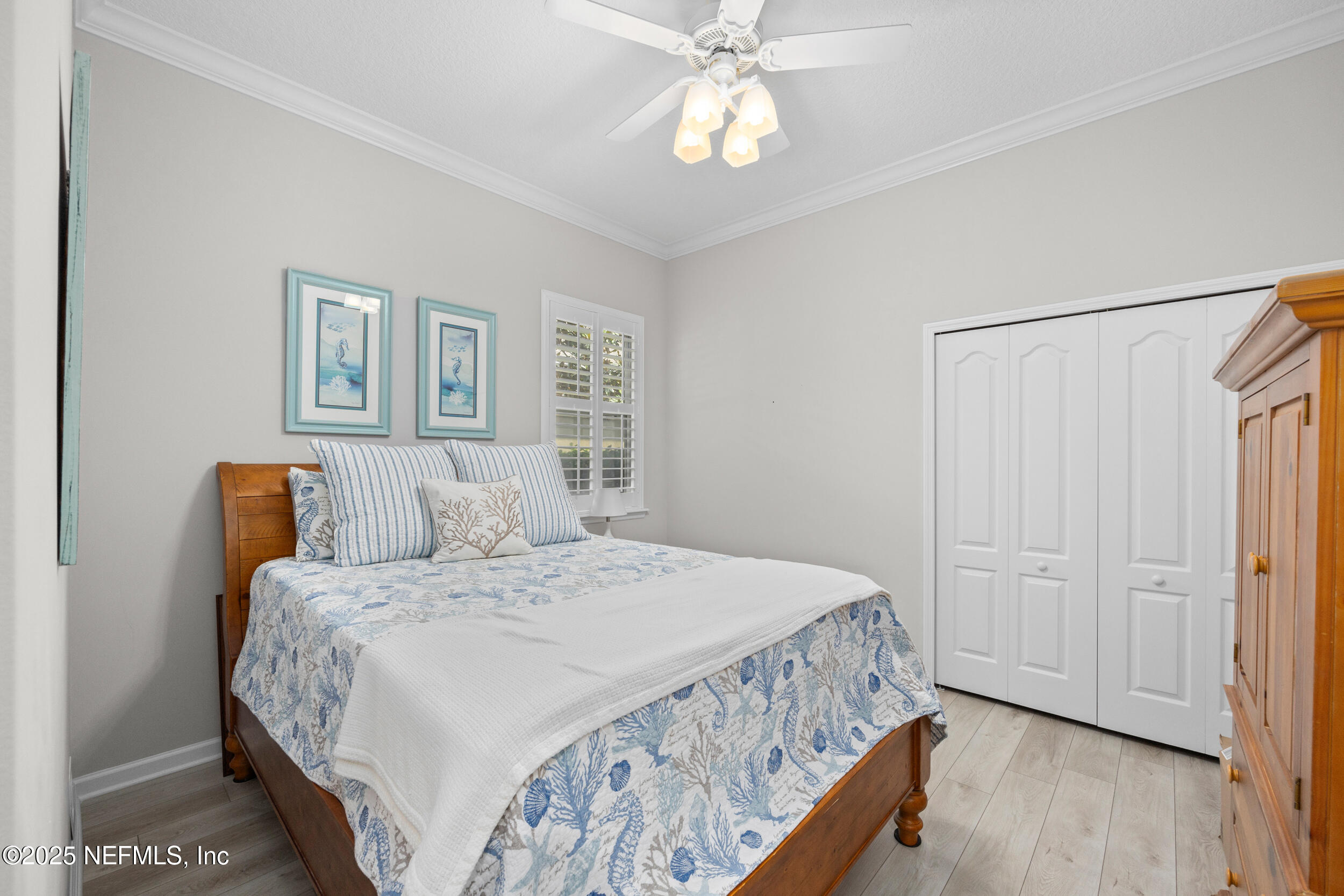 1854 West Cobblestone Lane St. Augustine, FL 32092 - Photo 35 of 72 a bedroom with a bed and a chandelier