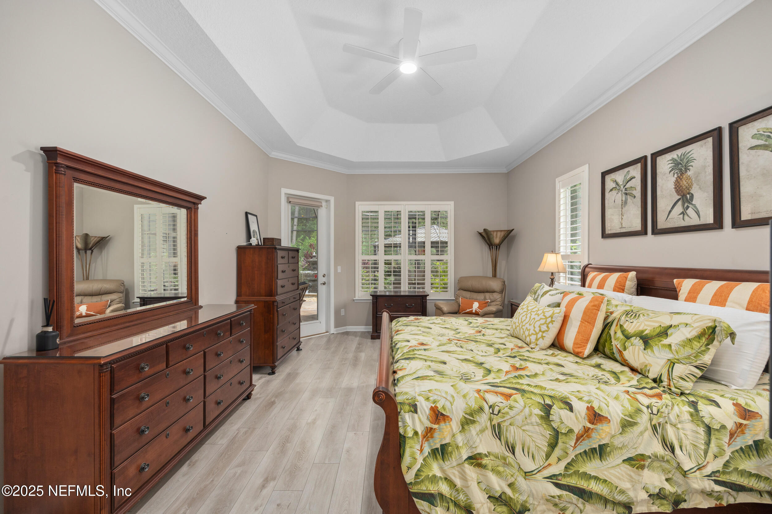 1854 West Cobblestone Lane St. Augustine, FL 32092 - Photo 38 of 72 a bedroom with a bed and wooden floor