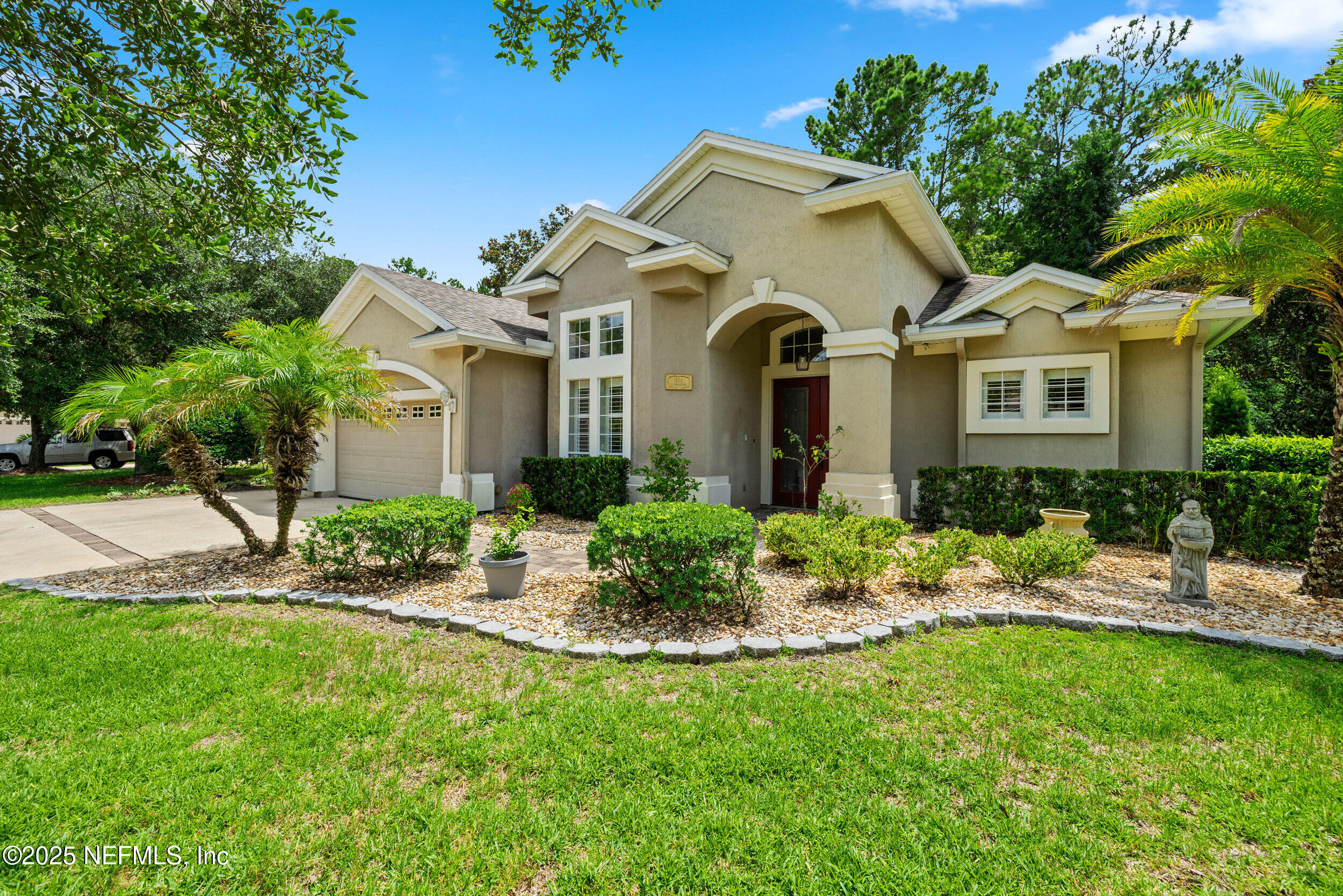 1854 West Cobblestone Lane St. Augustine, FL 32092 - Photo 4 of 72 a front view of a house with a yard