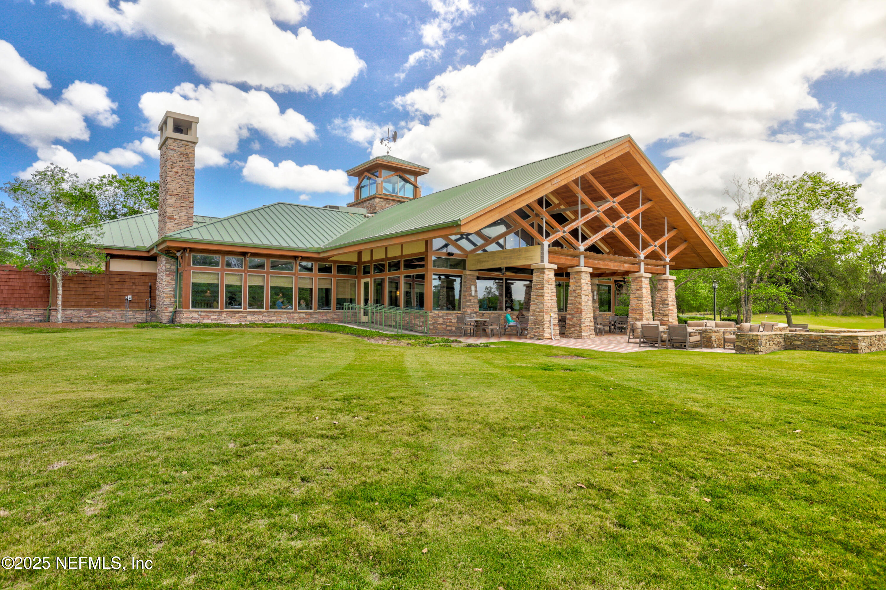 1854 West Cobblestone Lane St. Augustine, FL 32092 - Photo 52 of 72 a view of a house with a yard table and chairs