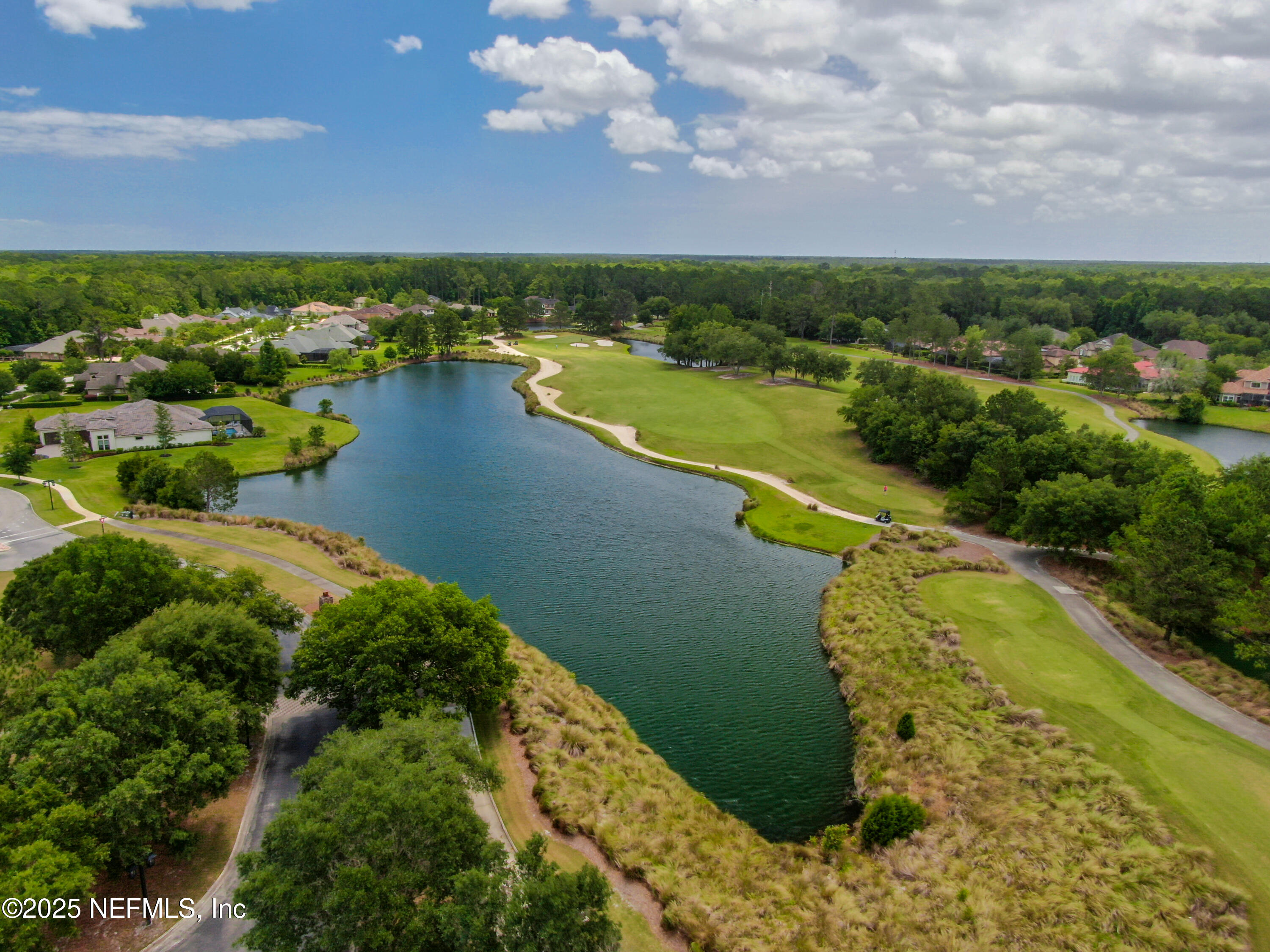 1854 West Cobblestone Lane St. Augustine, FL 32092 - Photo 69 of 72 an aerial view of residential houses with outdoor space and lake view