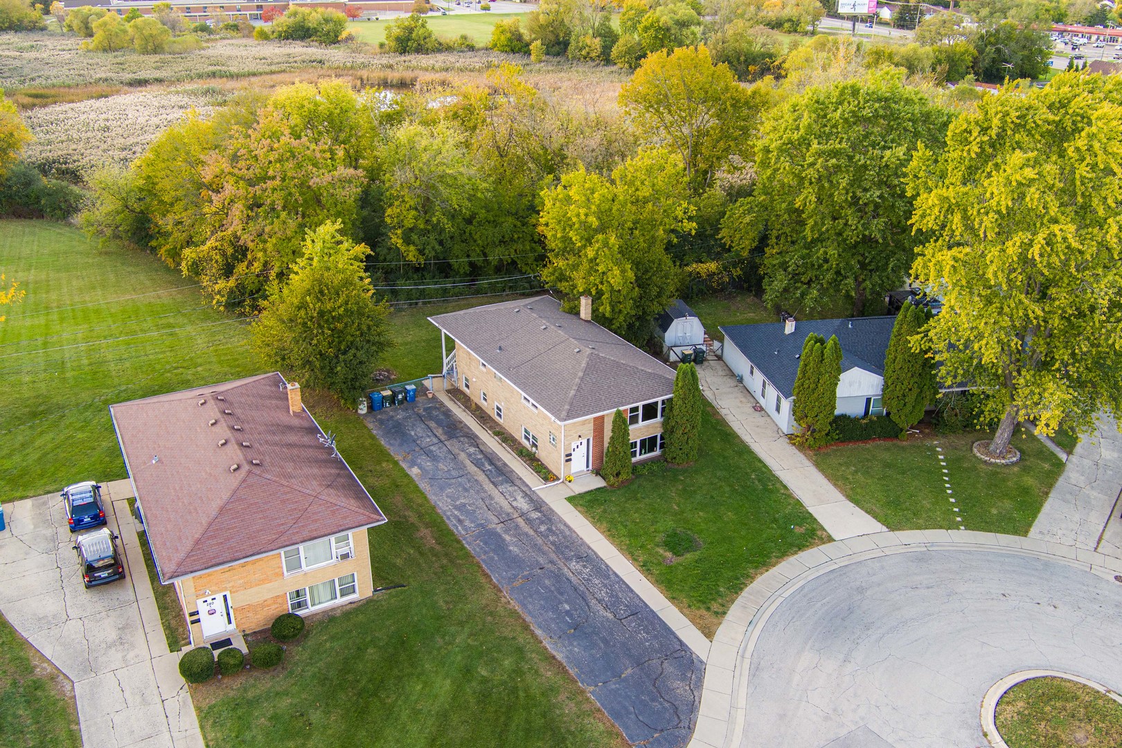 286 Wayne Court, Unit 2 Bartlett, IL 60103 - Photo 4 of 26 an aerial view of residential houses with outdoor space and trees