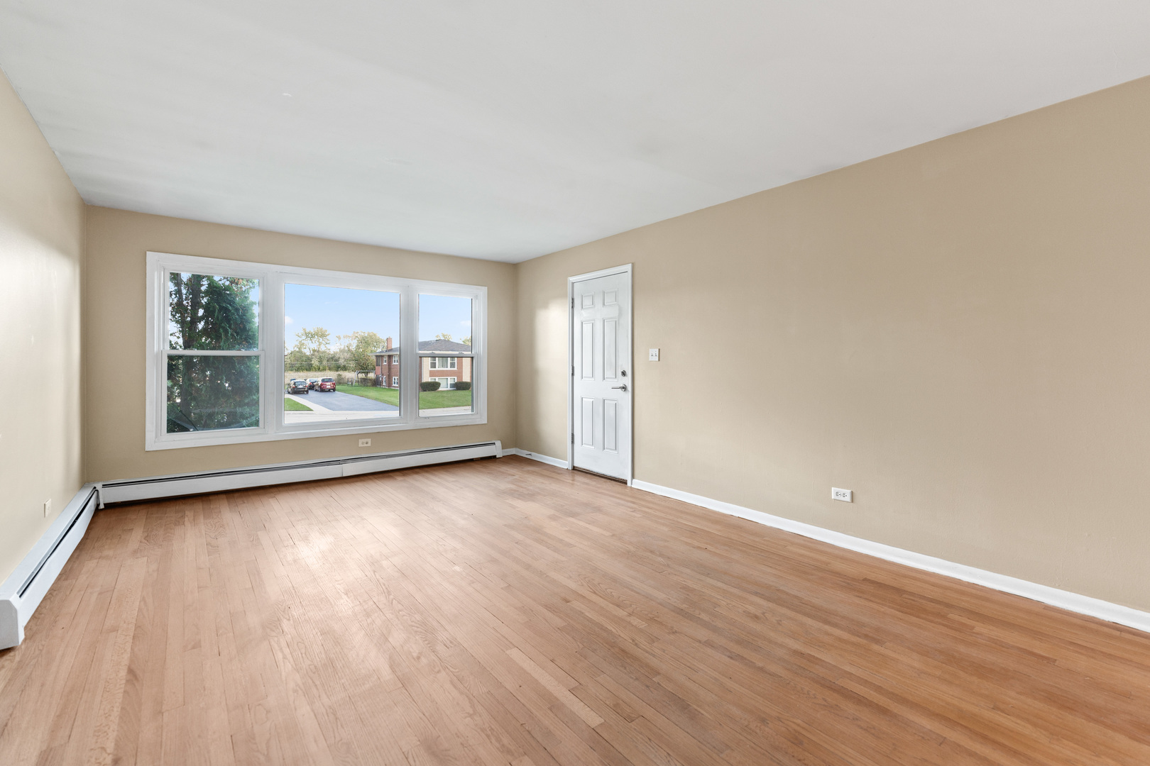 286 Wayne Court, Unit 2 Bartlett, IL 60103 - Photo 9 of 26 a view of a room with wooden floor and window