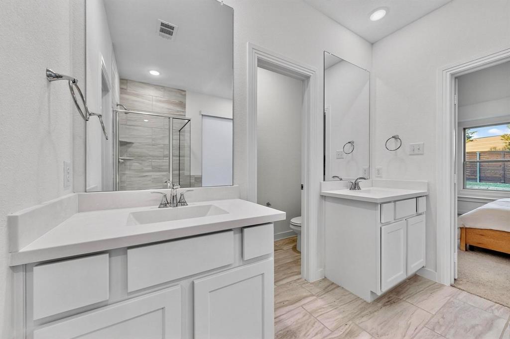 2017 Fall Crk Cove Mesquite, TX 75181 - Photo 18 of 40 Full bathroom featuring a shower stall, two vanities, ensuite bath, and recessed lighting