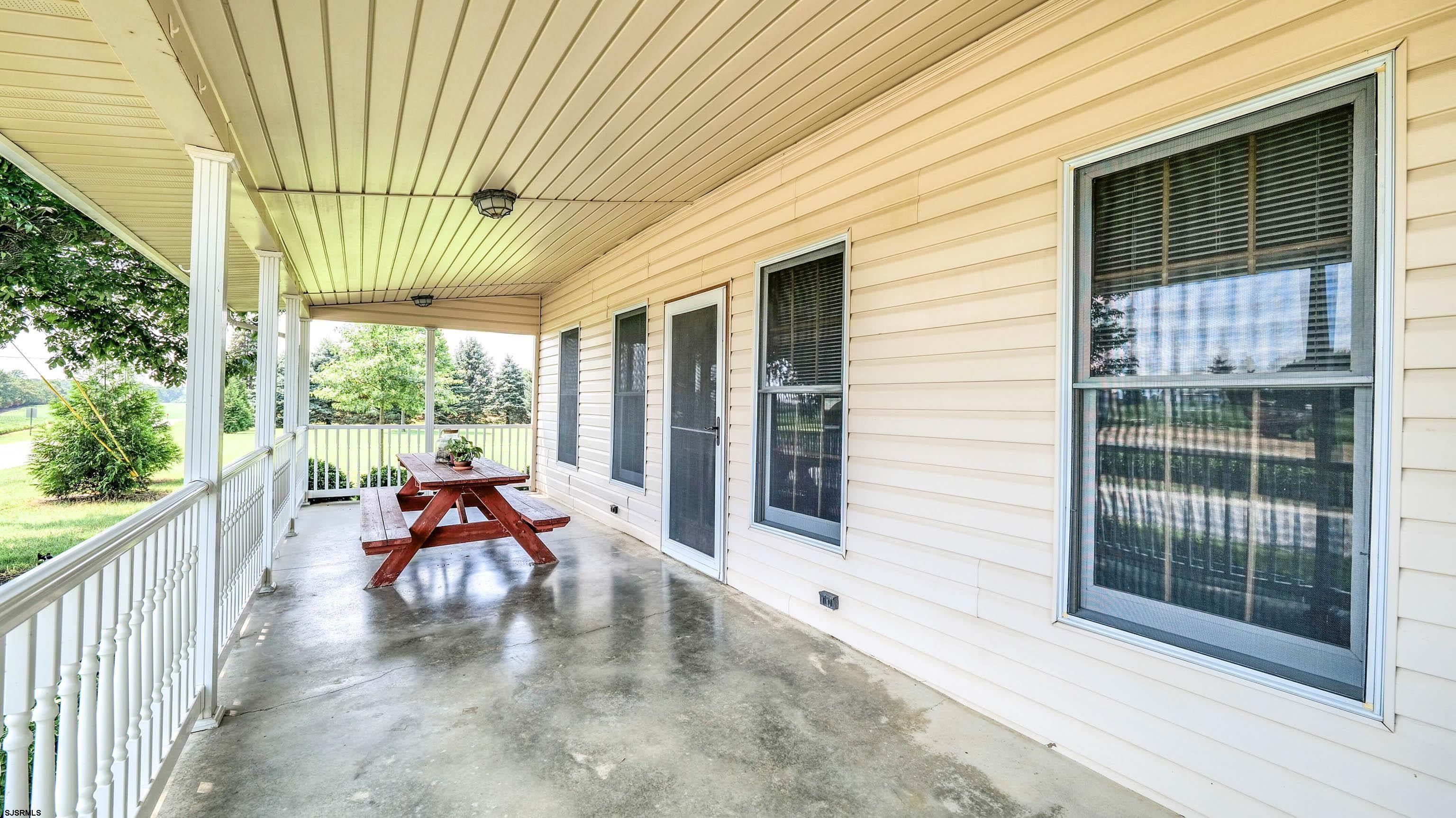 36 Cream Ridge Road Salem, NJ 08079 - Photo 17 of 53 a view of a porch with chairs and backyard