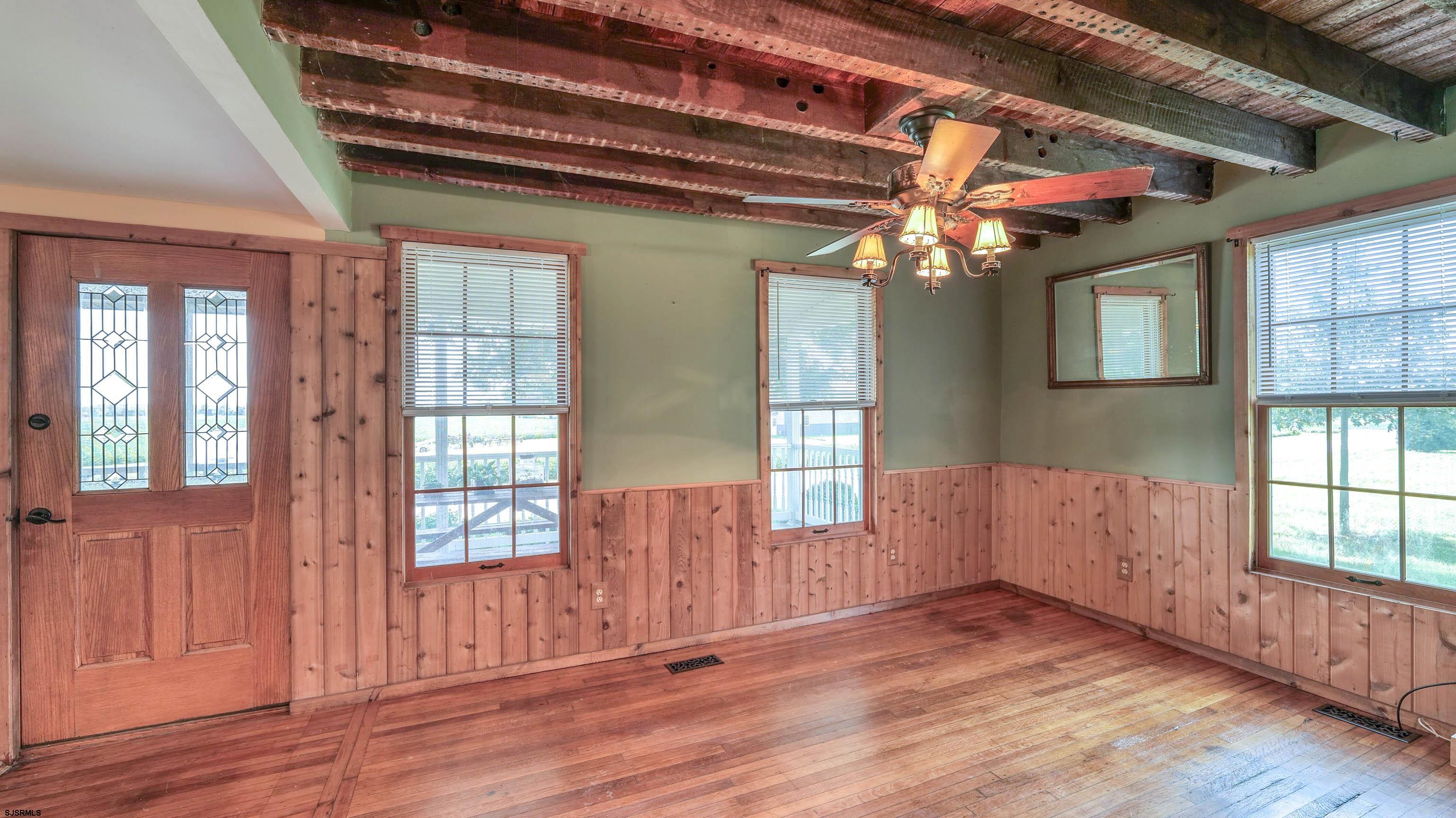 36 Cream Ridge Road Salem, NJ 08079 - Photo 21 of 53 an empty room with wooden floor fan and windows