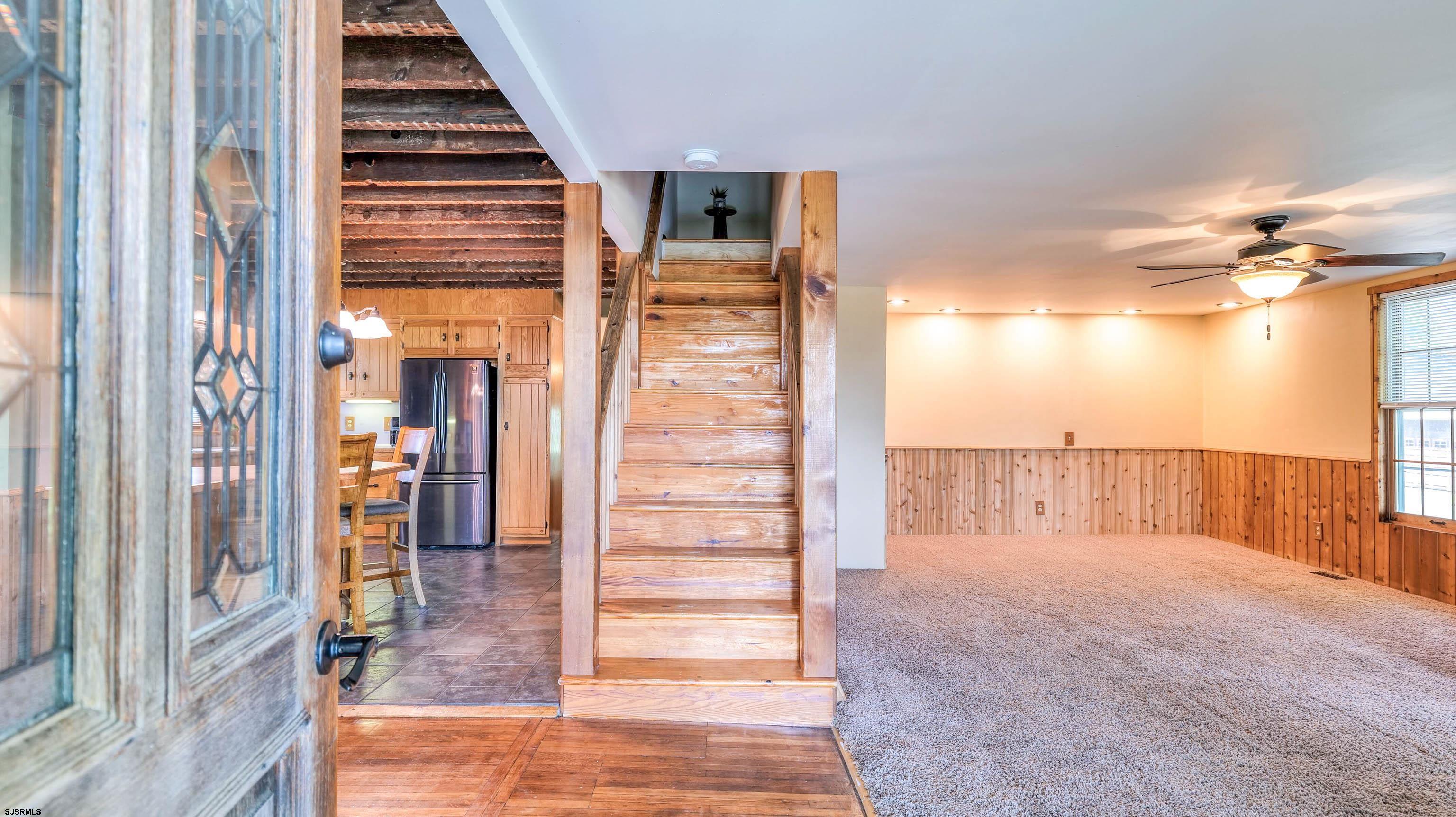 36 Cream Ridge Road Salem, NJ 08079 - Photo 32 of 53 a view of hallway with stairs and wooden floor