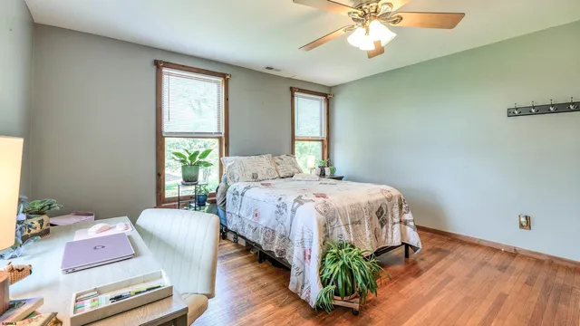 a spacious bathroom with a double vanity sink a mirror and a shower