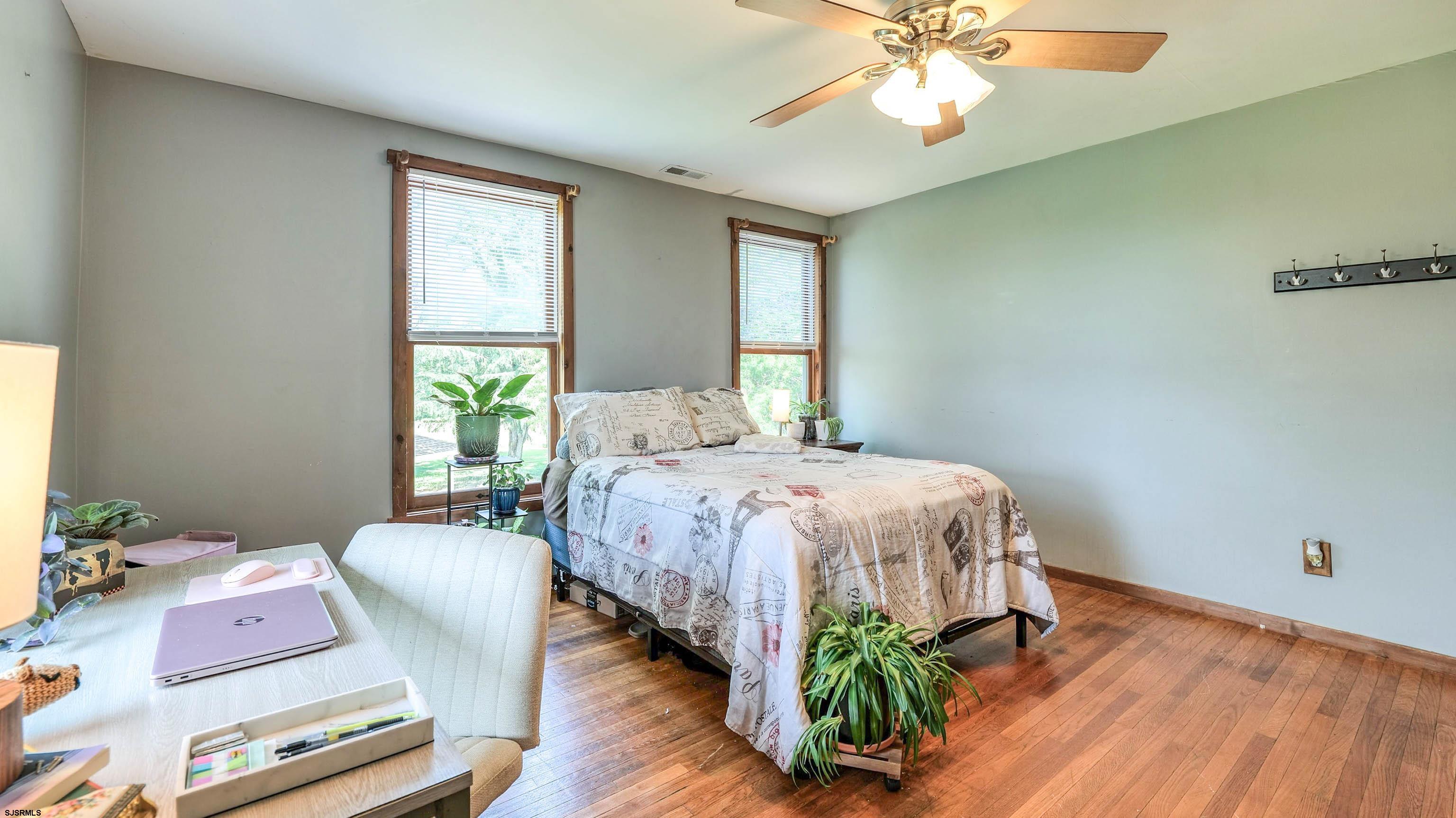 36 Cream Ridge Road Salem, NJ 08079 - Photo 37 of 53 a bedroom with a bed and wooden floor
