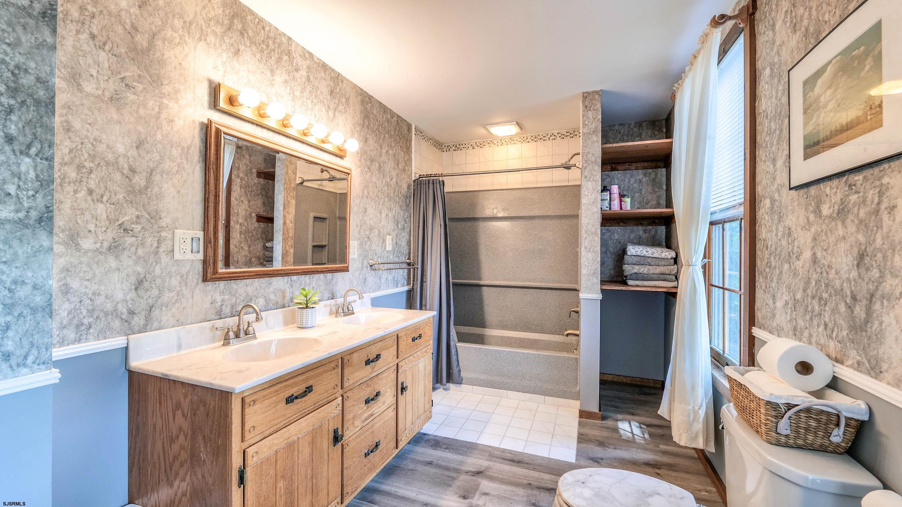 36 Cream Ridge Road Salem, NJ 08079 - Photo 38 of 53 a bathroom with a sink a mirror and a shower