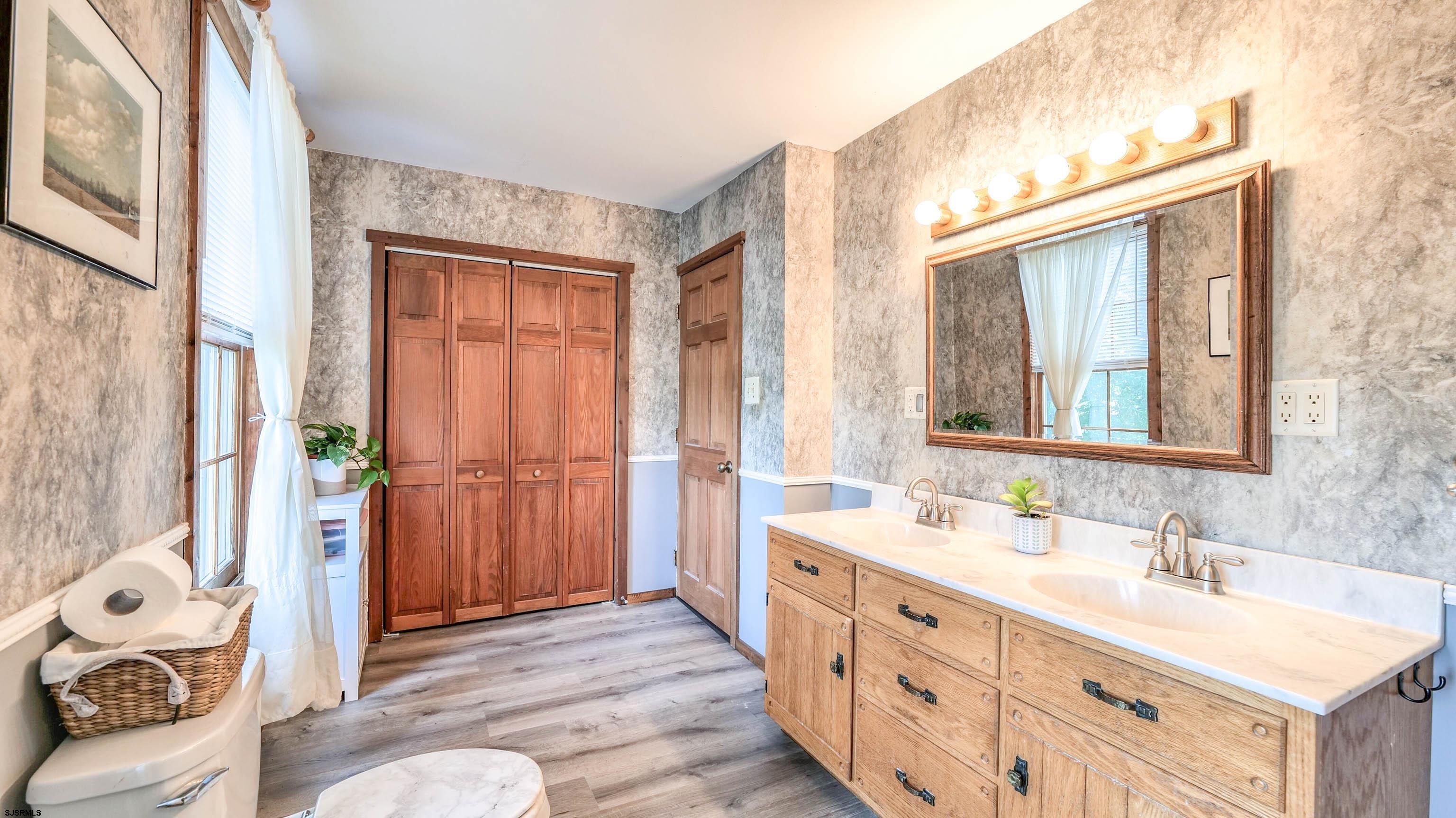 36 Cream Ridge Road Salem, NJ 08079 - Photo 39 of 53 a spacious bathroom with a double vanity sink a mirror and a shower