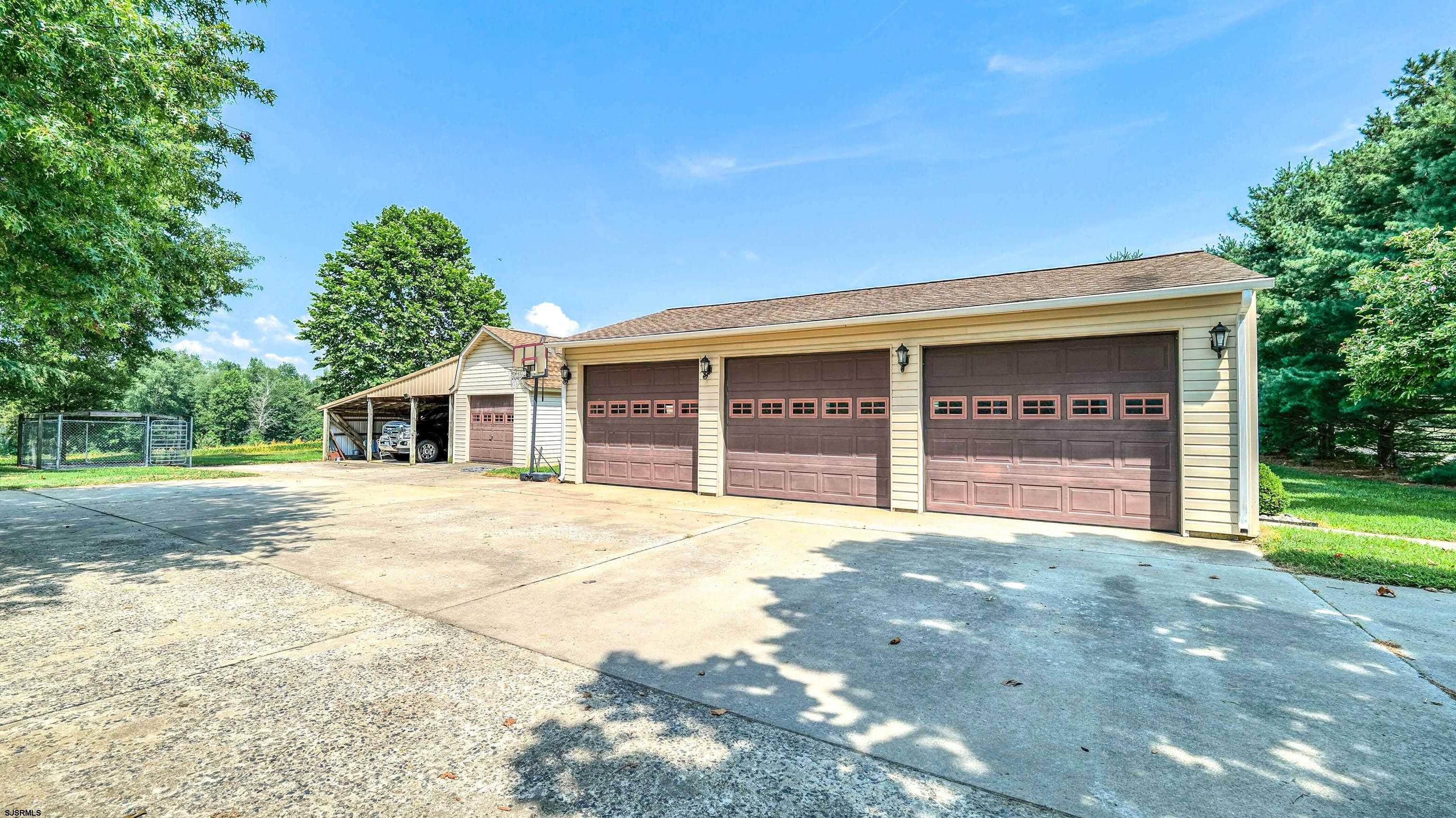 36 Cream Ridge Road Salem, NJ 08079 - Photo 42 of 53 a front view of a house with a yard and garage