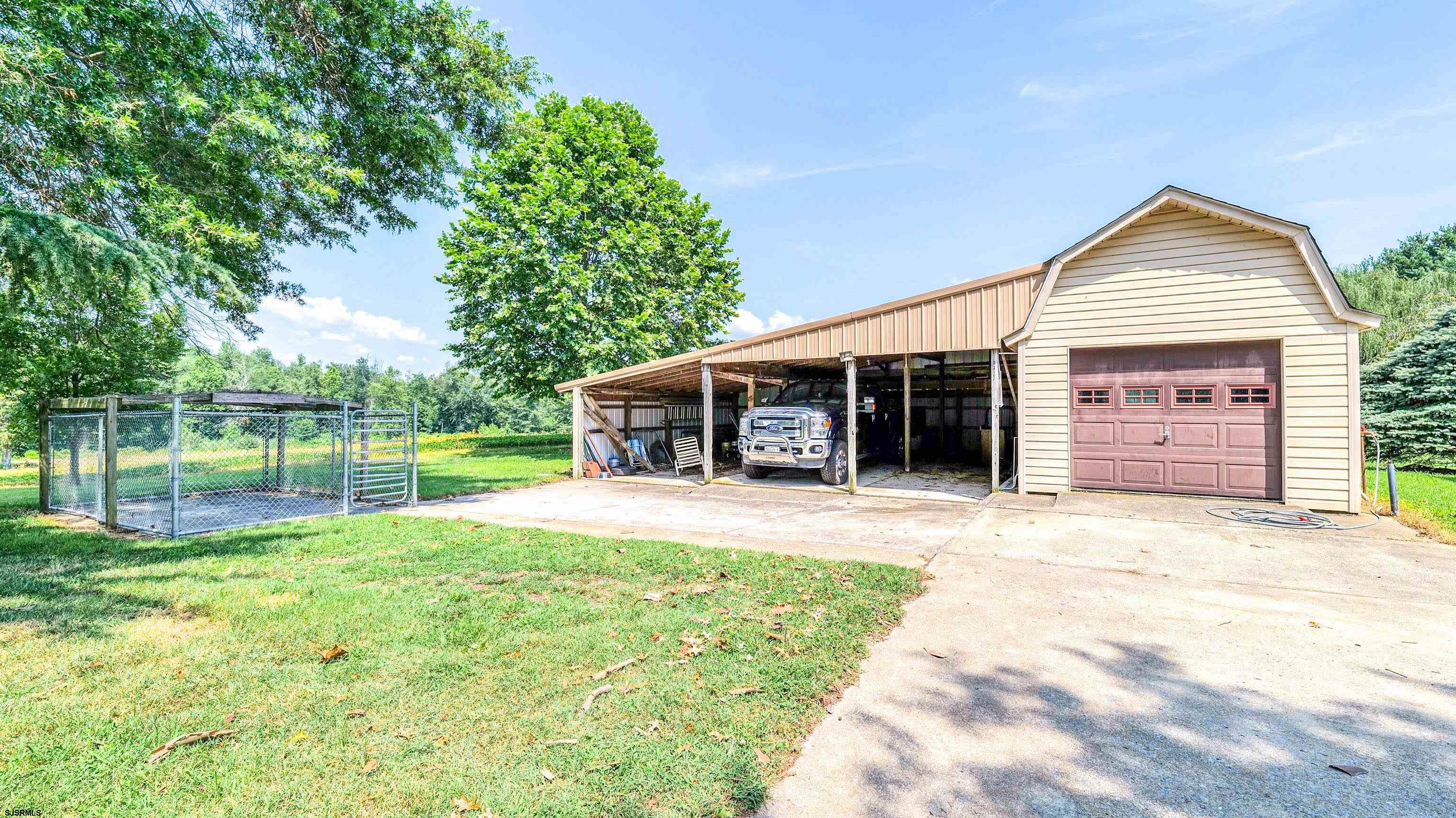 36 Cream Ridge Road Salem, NJ 08079 - Photo 44 of 53 a front view of a house with a yard and garage