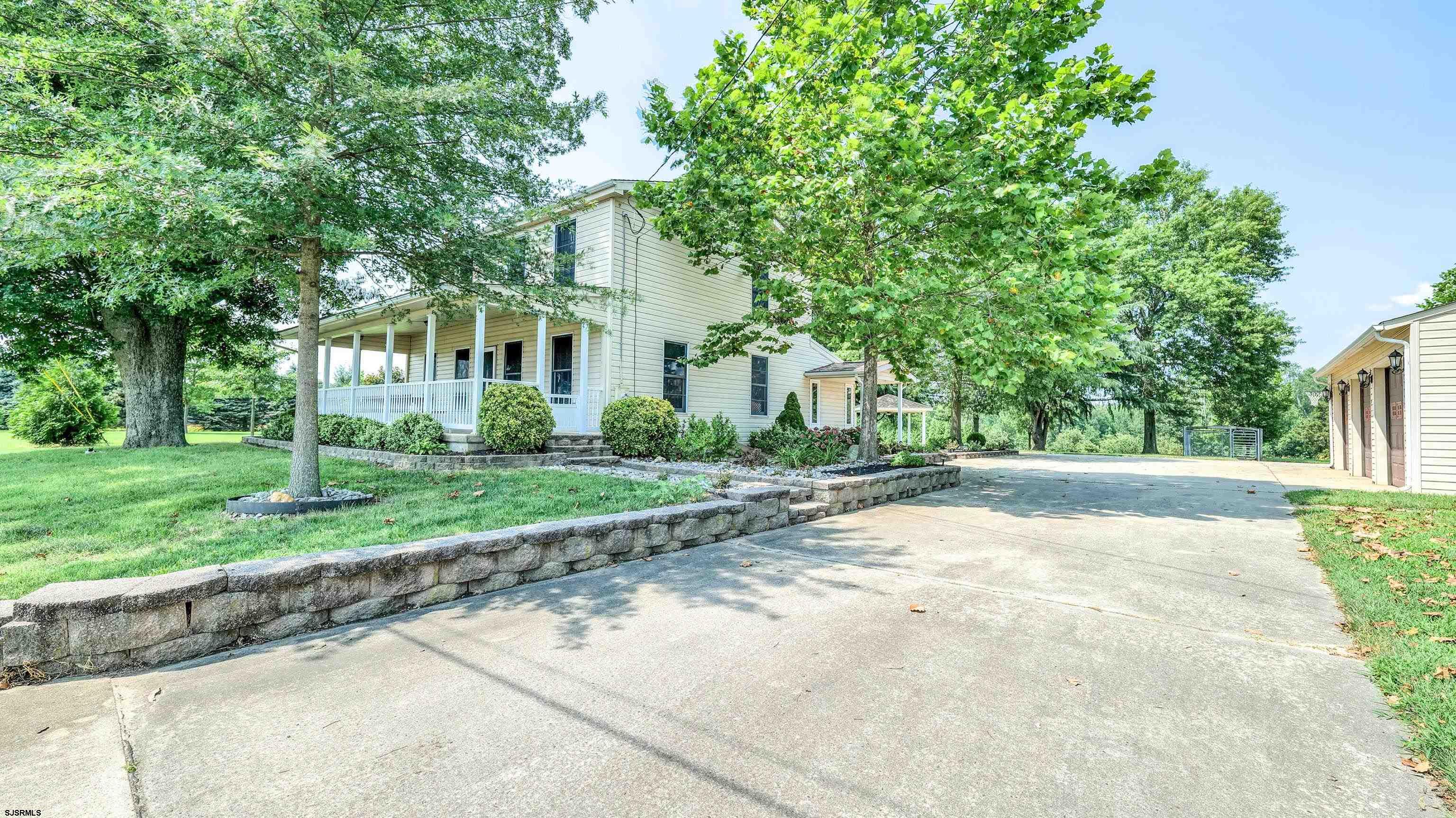 36 Cream Ridge Road Salem, NJ 08079 - Photo 6 of 53 a view of a house with a yard and large trees