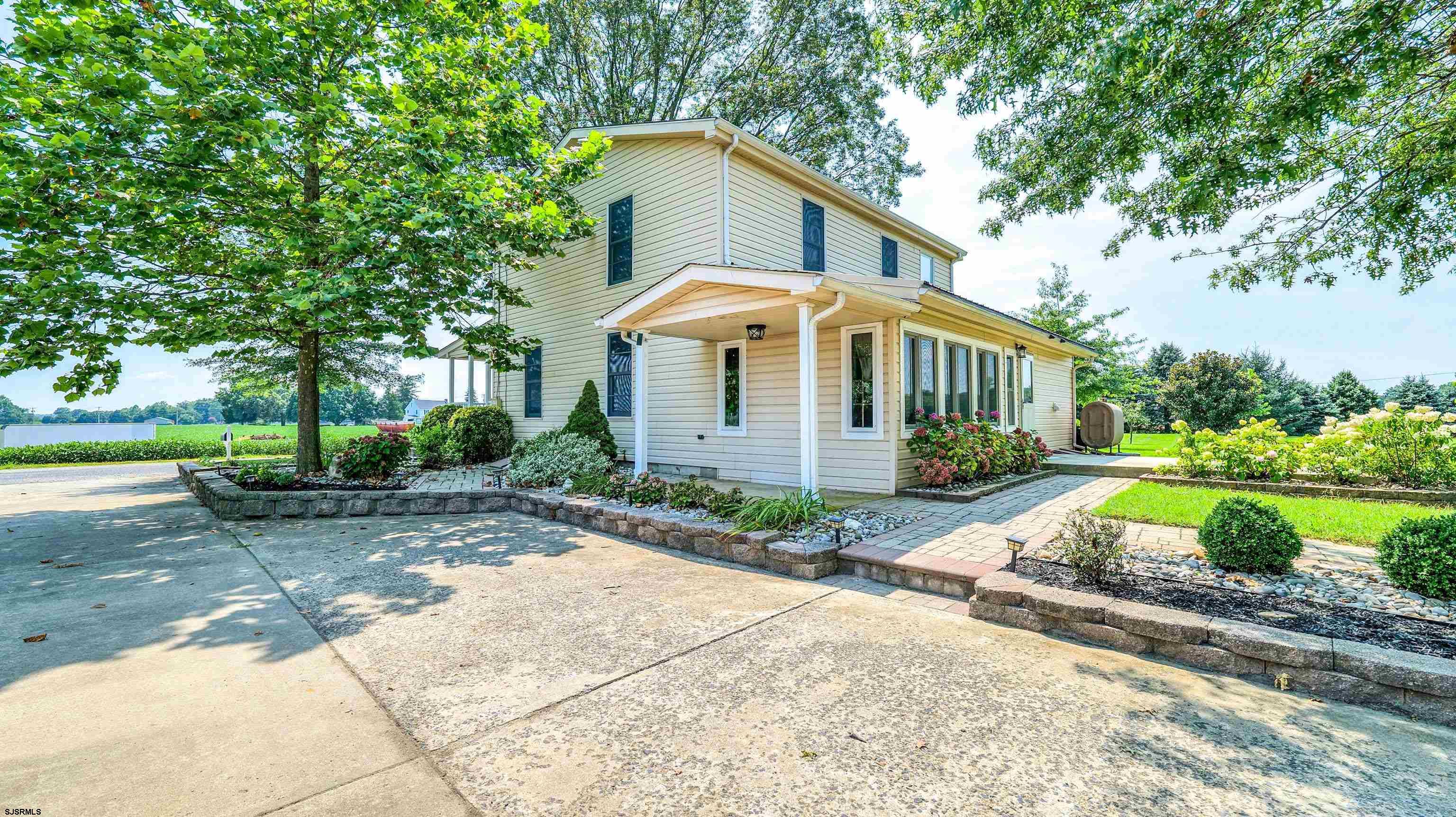 36 Cream Ridge Road Salem, NJ 08079 - Photo 7 of 53 a front view of a house with a yard and lake view