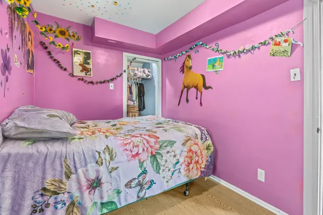 a bedroom with a bed and a couch