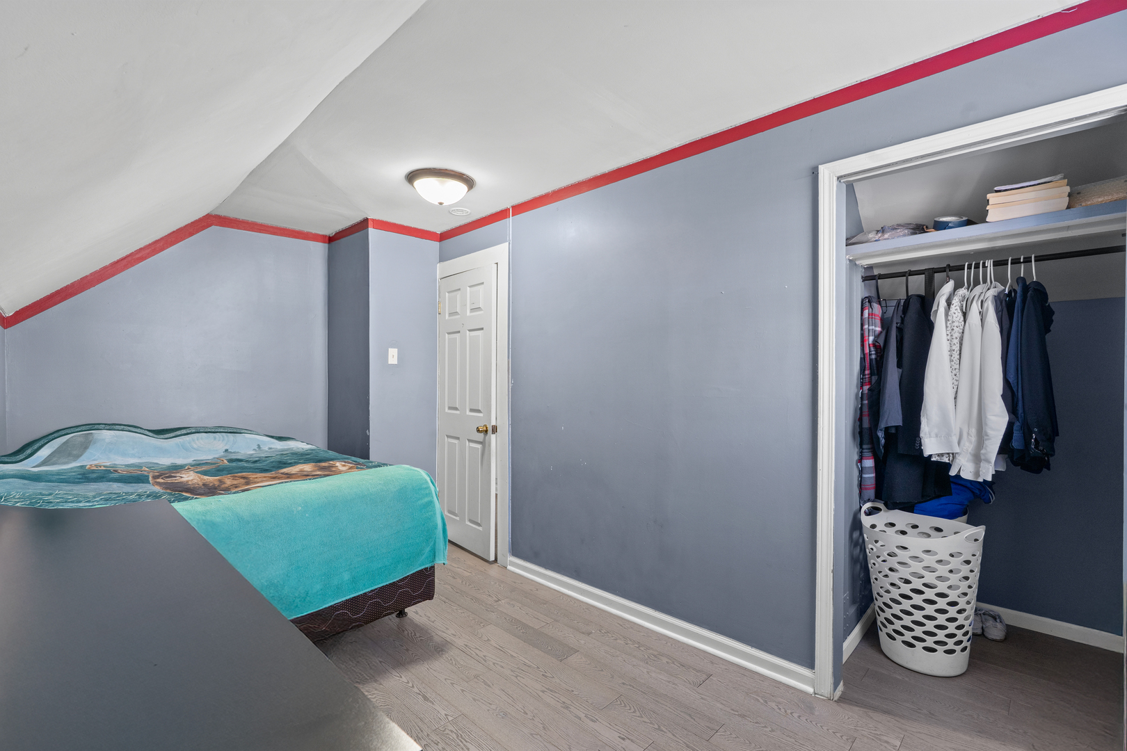 2103 North Long Avenue Chicago, IL 60639 - Photo 16 of 21 a bedroom with a bed and a closet