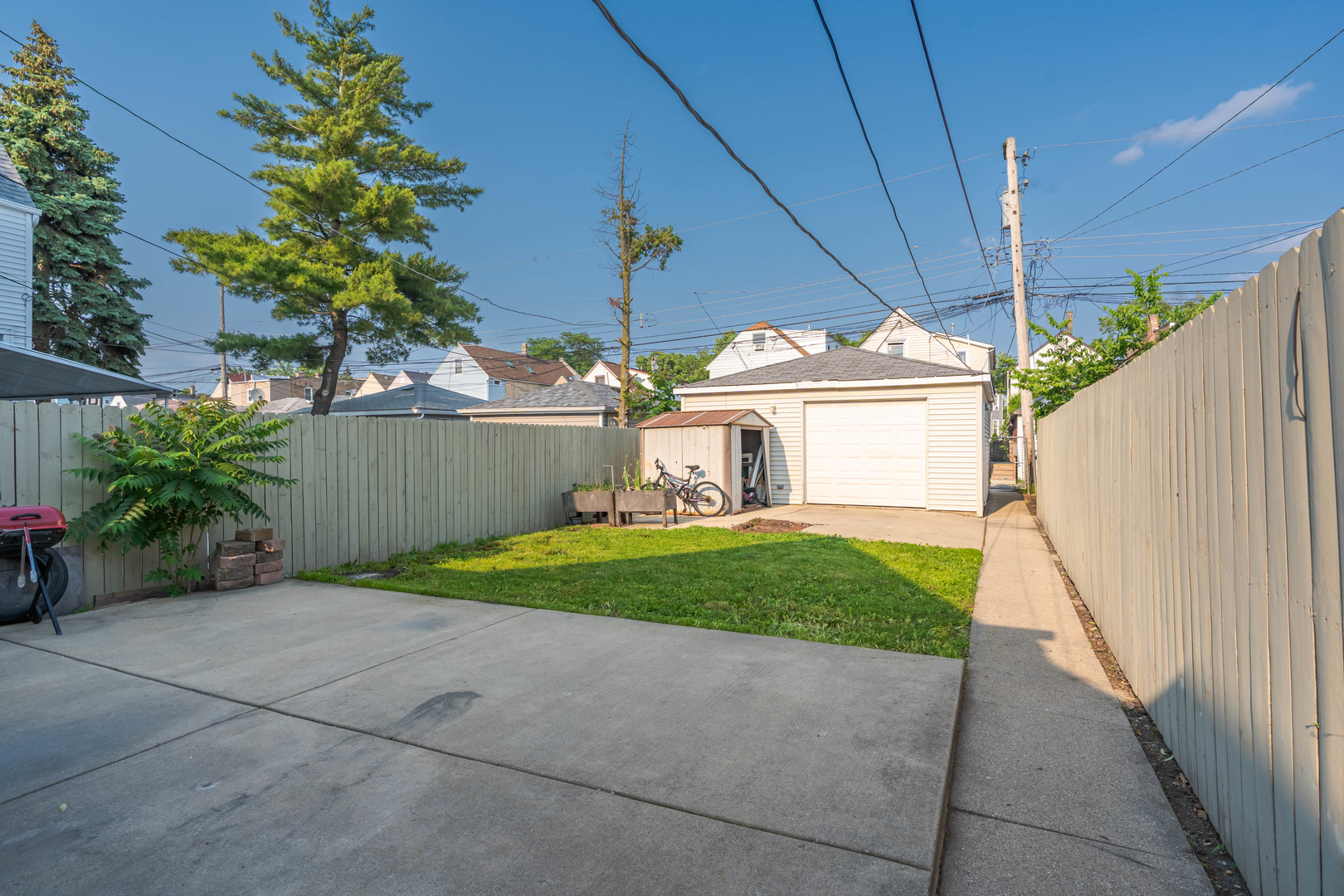 2103 North Long Avenue Chicago, IL 60639 - Photo 20 of 21 a front view of a house with garden